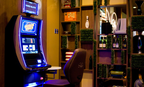 Glowing slot machine in front of modular shelving